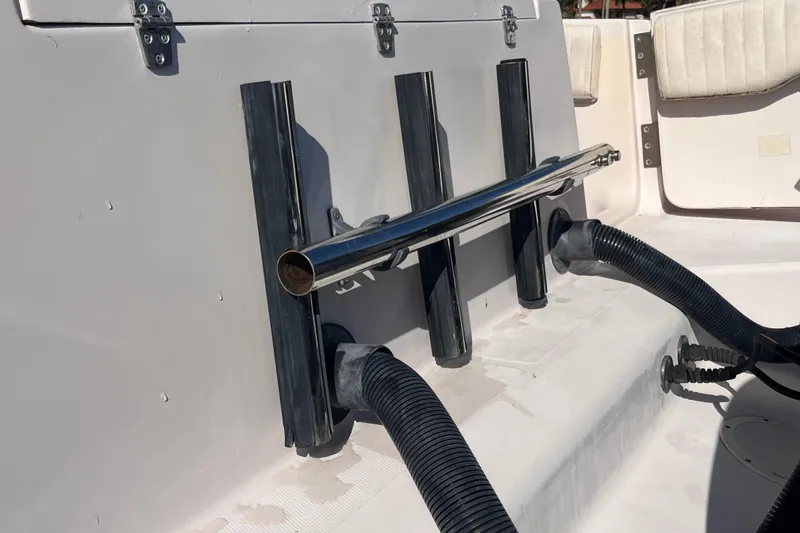Slide: The Image of Rod holders and hoses on a 2006 Grady-White Release 283 boat deck. - 41