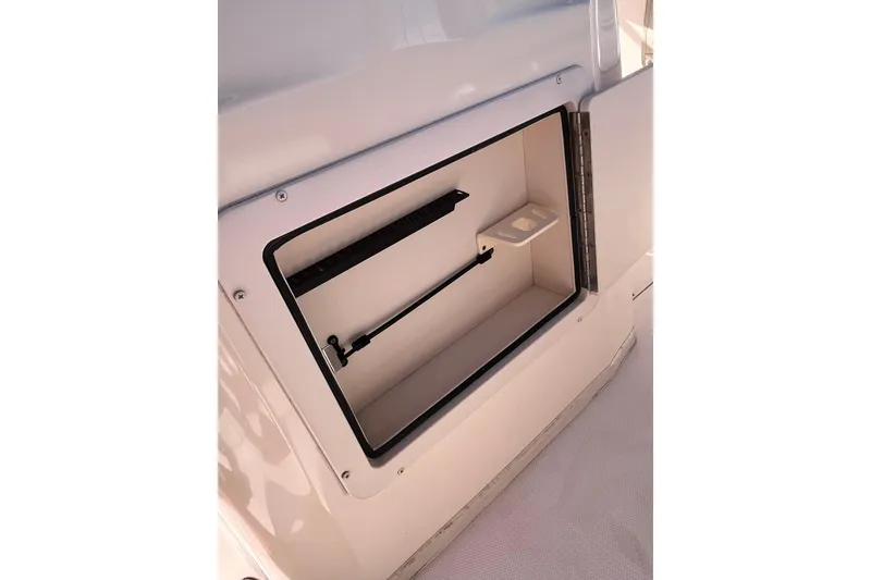 Slide: The Image of Open storage compartment on 2006 Grady-White Release 283 boat. - 42