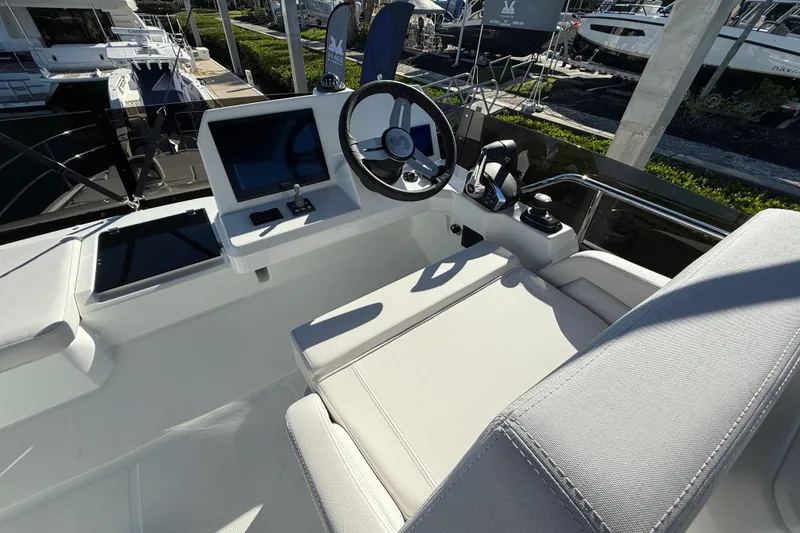 Slide: The Image of 2026 Beneteau Antares 12 helm station with modern controls and comfortable seating. - 18