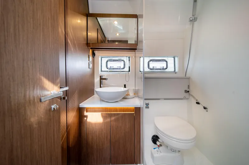 Slide: The Image of Modern bathroom in 2026 Beneteau Antares 12 yacht, featuring sleek wood finishes and contemporary fixtures. - 36