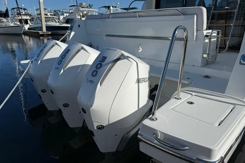 Slide: The Image of 2026 Beneteau Antares 12 with triple Mercury 300 V8 engines docked at marina. - 7