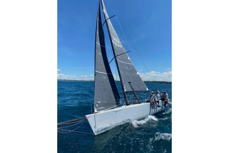 Slide: The Image of Sailing on a Farr 11s yacht, 2009 model, under clear blue skies. - 2
