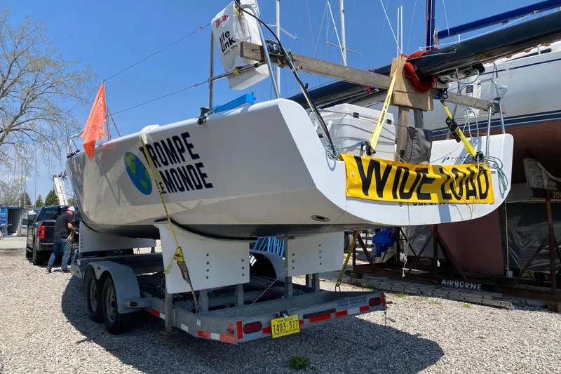 Slide: The Image of Farr 11s sailboat on trailer with "Wide Load" sign, 2009 model. - 6