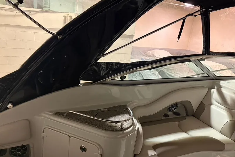 Slide: The Image of 2019 Crownline 264 CR boat interior with seating and storage compartments. - 10