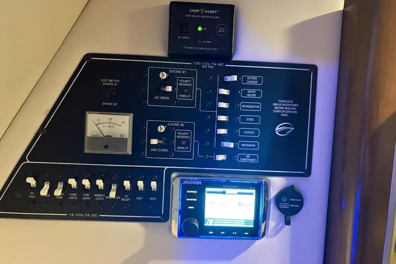 Slide: The Image of Control panel of a 2019 Crownline 264 CR boat with various switches and displays. - 17