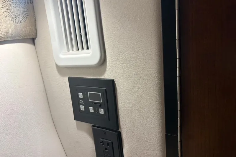 Slide: The Image of Control panel and vent inside 2019 Crownline 264 CR boat cabin. - 22