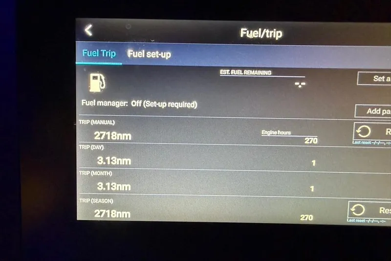 Slide: The Image of Fuel trip display on 2019 Crownline 264 CR boat, showing nautical miles and engine hours. - 27