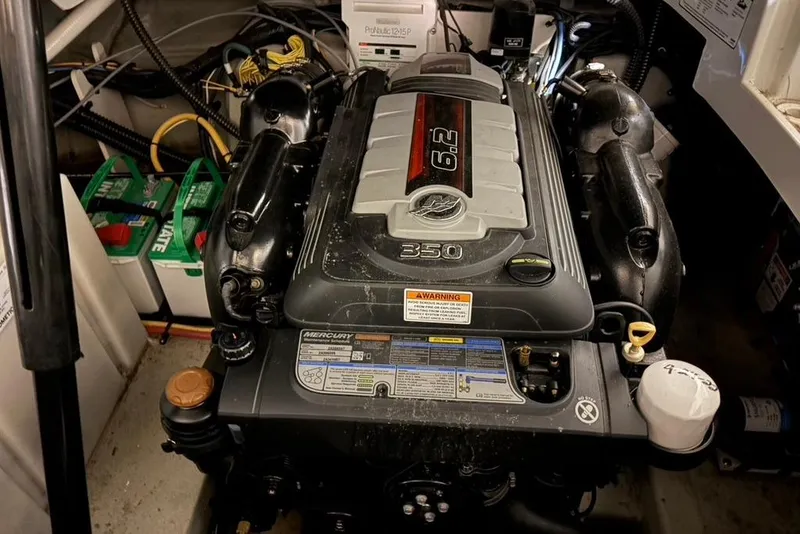 Slide: The Image of Engine compartment of a 2019 Crownline 264 CR boat with Mercury 6.2L engine. - 28