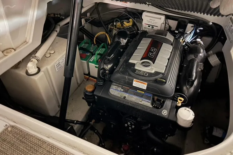 Slide: The Image of Engine compartment of a 2019 Crownline 264 CR boat, featuring a 6.2L engine. - 29