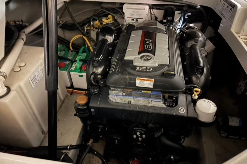 Slide: The Image of Engine compartment of 2019 Crownline 264 CR boat, featuring a 6.2L MerCruiser engine. - 33