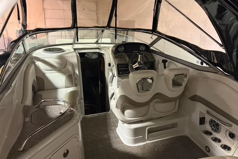 Slide: The Image of 2019 Crownline 264 CR boat interior with helm, seating, and modern design features. - 5