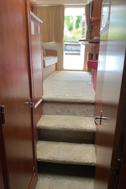 Slide: The Image of Interior view of 2007 Silverton 33 Convertible yacht with carpeted stairs. - 30