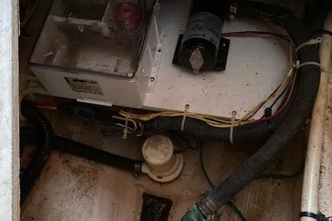 Slide: The Image of Engine compartment of a 2007 Silverton 33 Convertible boat with wiring and components. - 40