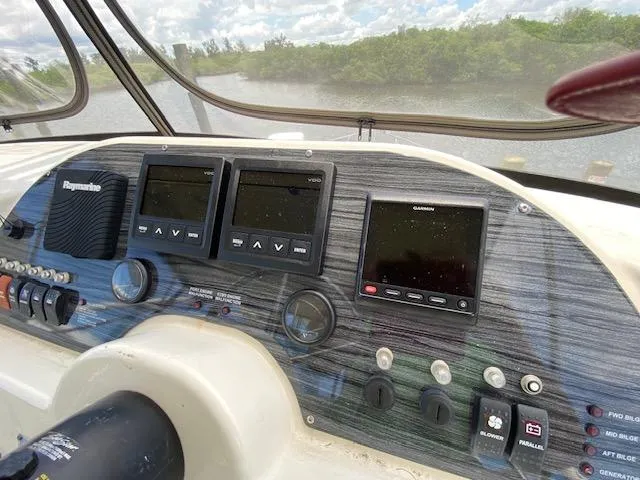 Slide: The Image of Dashboard of a 2007 Silverton 33 Convertible boat with navigation instruments. - 45