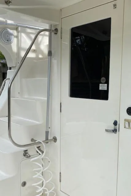 Slide: The Image of 2007 Silverton 33 Convertible boat interior with stairs and door. - 9