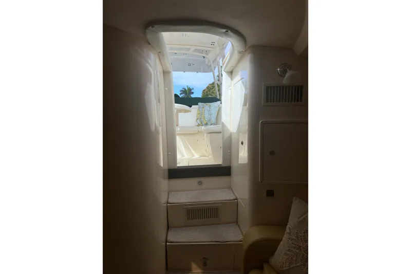 Slide: The Image of Interior view of 2004 Intrepid 377 Walkaround boat, showing cabin steps and exterior. - 21