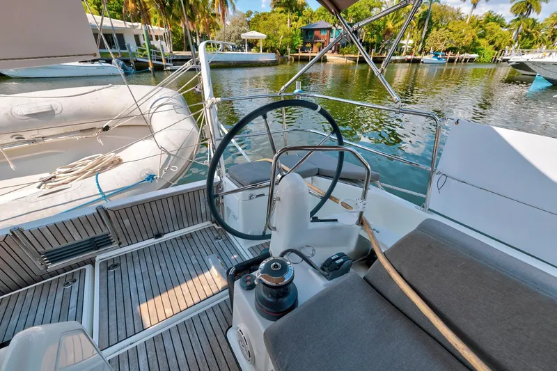 Slide: The Image of Cockpit of 2021 Jeanneau Sun Odyssey 440 sailboat with scenic waterfront view. - 15
