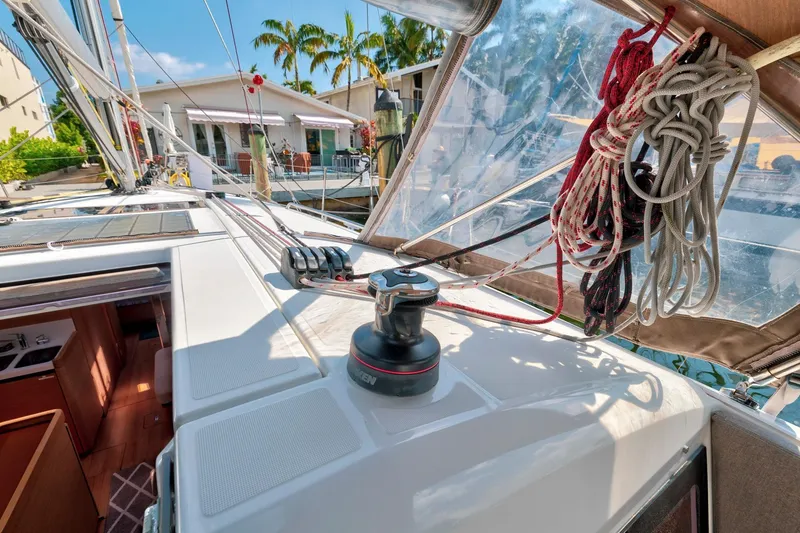 Slide: The Image of Jeanneau Sun Odyssey 440 sailboat deck with ropes and winch, 2021 model. - 16