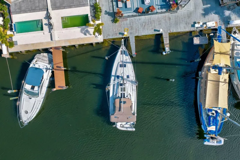 Slide: The Image of Aerial view of 2021 Jeanneau Sun Odyssey 440 docked between boats. - 2