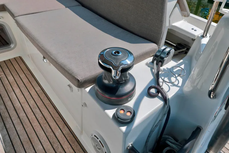 Slide: The Image of Jeanneau Sun Odyssey 440, 2021 model, deck view with winch and seating area. - 29