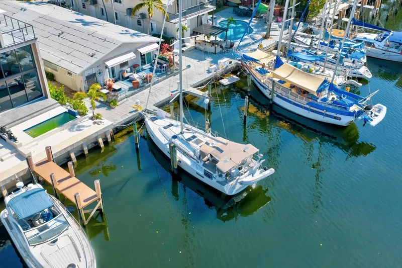 Slide: The Image of Aerial view of Jeanneau Sun Odyssey 440 docked at marina, 2021 model. - 3