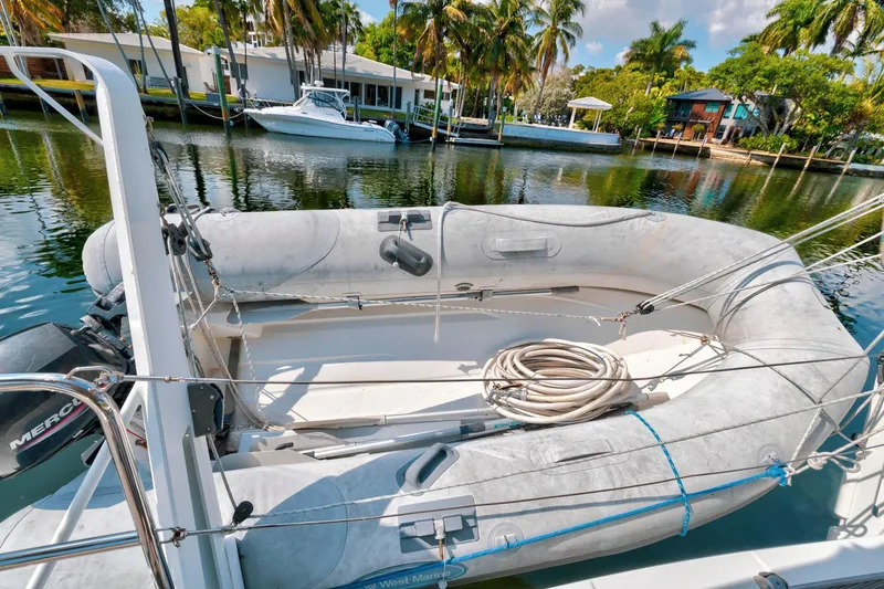 Slide: The Image of Inflatable dinghy on Jeanneau Sun Odyssey 440 yacht, docked by waterfront homes, 2021 model. - 30