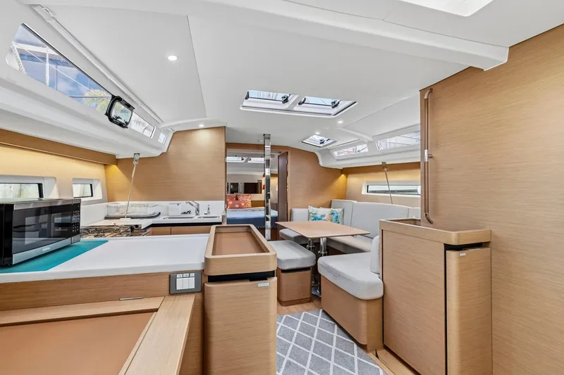Slide: The Image of Modern interior of 2021 Jeanneau Sun Odyssey 440 yacht with sleek design and cozy seating. - 35