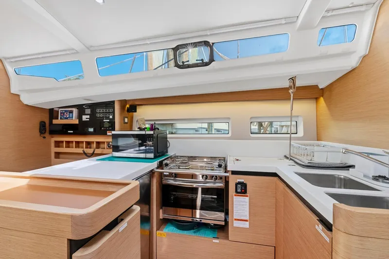 Slide: The Image of Modern kitchen interior of 2021 Jeanneau Sun Odyssey 440 yacht with sleek design and appliances. - 37