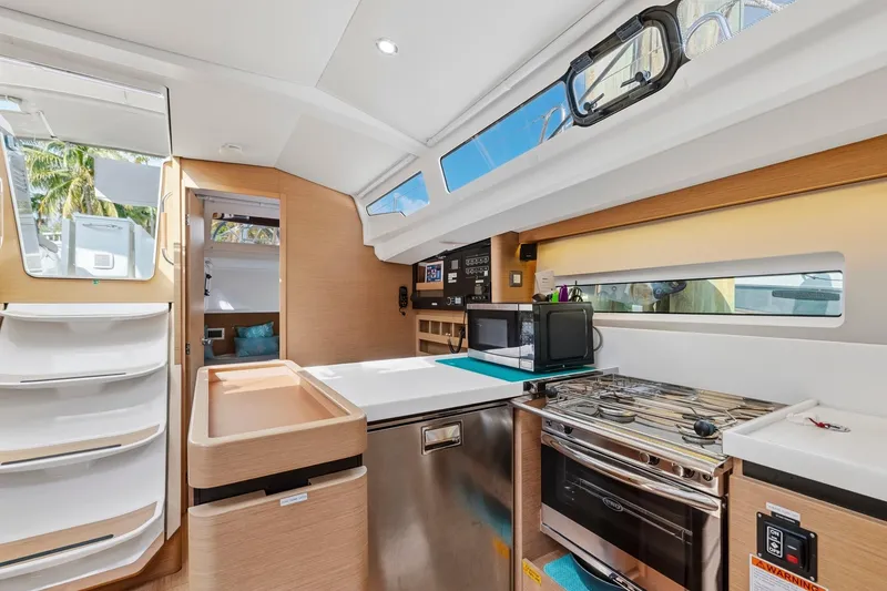 Slide: The Image of Interior of 2021 Jeanneau Sun Odyssey 440 yacht kitchen with modern appliances. - 38