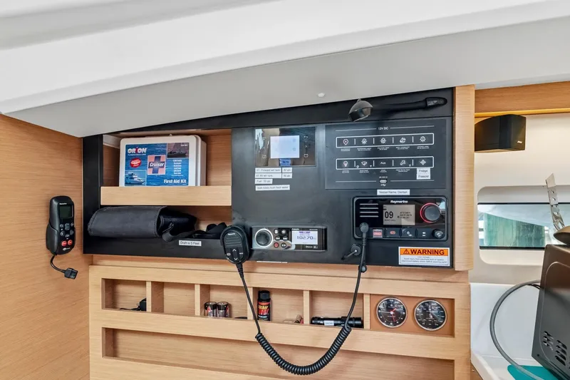 Slide: The Image of Control panel of 2021 Jeanneau Sun Odyssey 440 yacht, featuring navigation and communication equipment. - 41