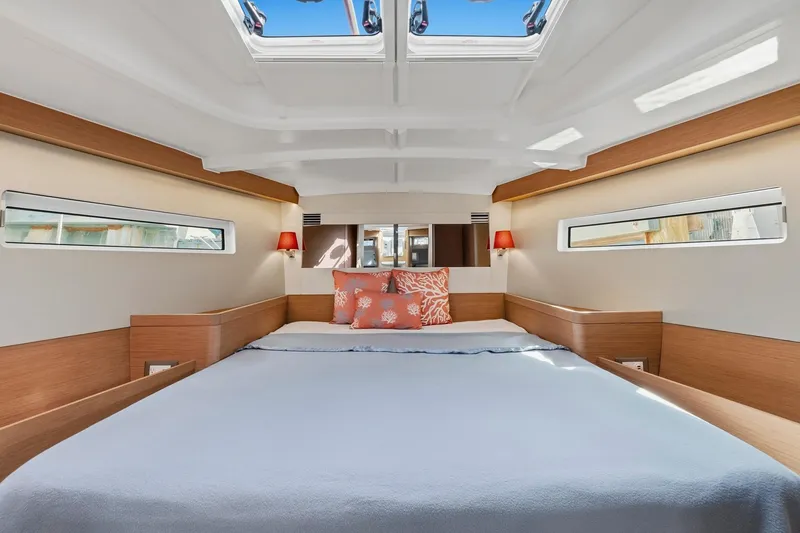 Slide: The Image of Luxurious interior of 2021 Jeanneau Sun Odyssey 440 yacht with skylight and cozy bedding. - 43