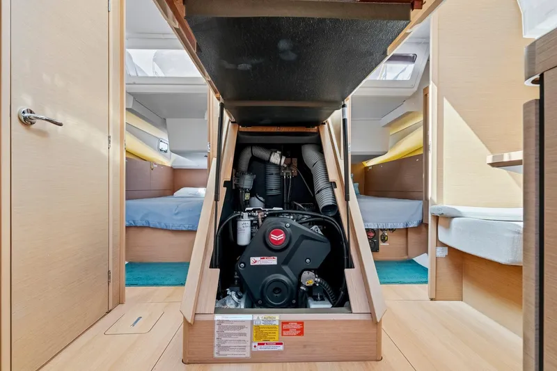 Slide: The Image of Engine compartment of 2021 Jeanneau Sun Odyssey 440 sailboat, showcasing interior layout. - 49