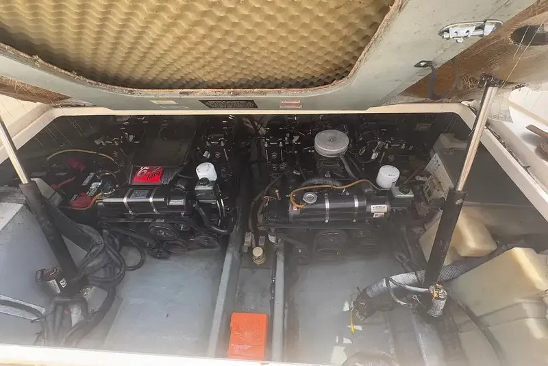 Slide: The Image of Engine compartment of a 2001 Sea Ray Sundancer 310 boat, showing dual engines. - 11