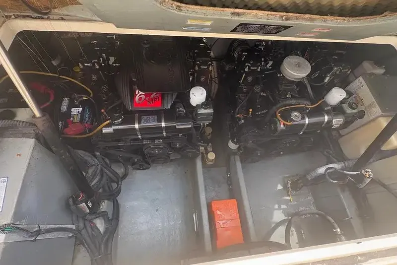 Slide: The Image of Engine compartment of a 2001 Sea Ray Sundancer 310 boat, showing dual engines. - 12