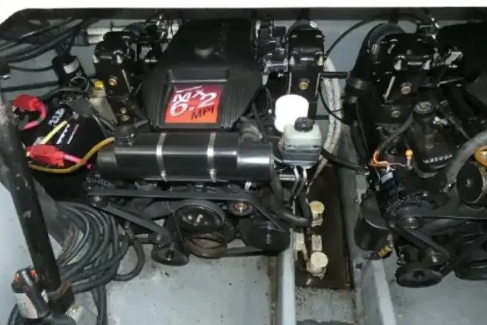 Slide: The Image of Engine compartment of a 2001 Sea Ray Sundancer 310 boat, featuring dual engines. - 13