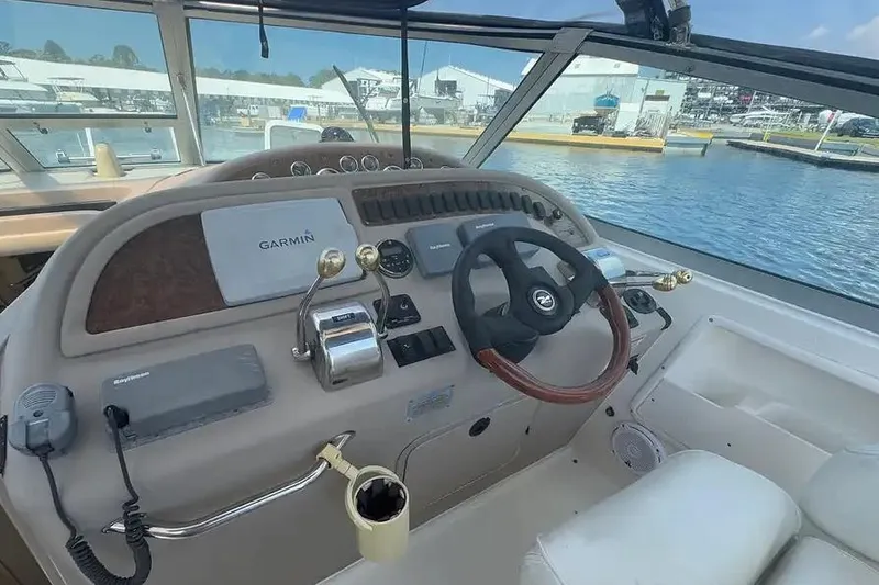 Slide: The Image of Helm of 2001 Sea Ray Sundancer 310 with Garmin navigation, dockside view. - 2