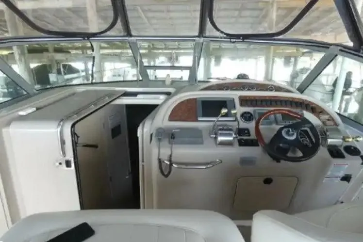 Slide: The Image of 2001 Sea Ray Sundancer 310 helm with steering wheel and control panel. - 3
