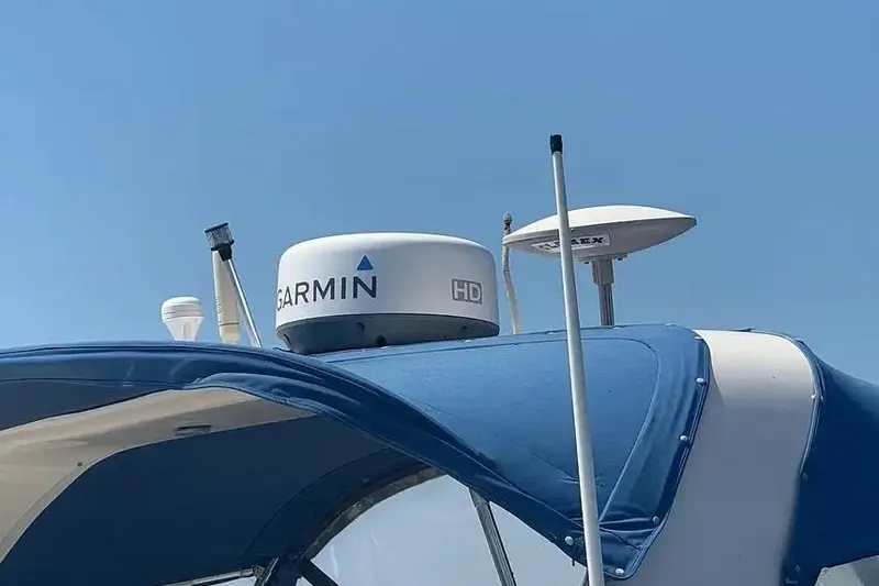 Slide: The Image of 2001 Sea Ray Sundancer 310 with Garmin HD radar and blue canopy. - 4