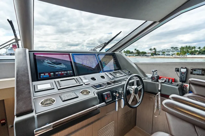 Slide: The Image of Helm of 2019 Sunseeker 86 Yacht with advanced navigation displays and controls. - 20