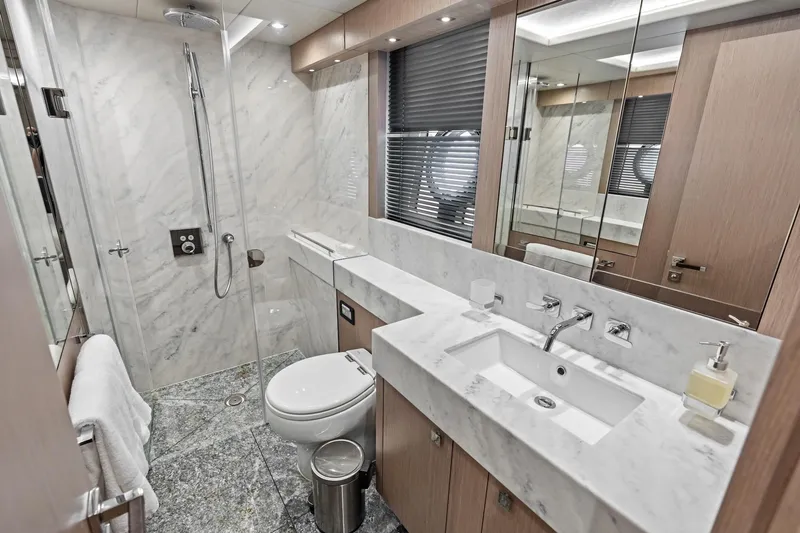 Slide: The Image of Luxurious bathroom in 2019 Sunseeker 86 Yacht with marble finishes and modern fixtures. - 31