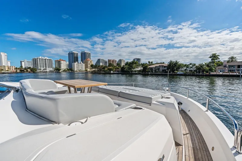 Slide: The Image of Luxurious 2019 Sunseeker 86 Yacht deck with city skyline and waterfront views. - 38
