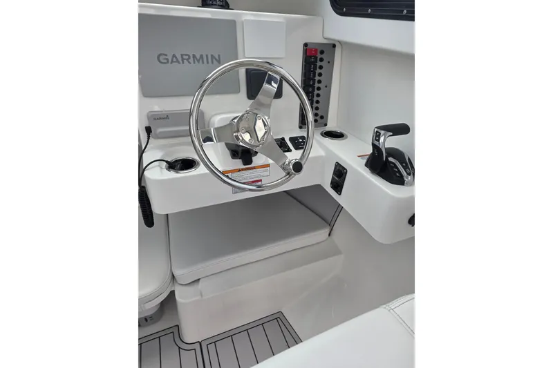 Slide: The Image of Steering console of 2026 Parker 247 Explorer boat with Garmin navigation system. - 18