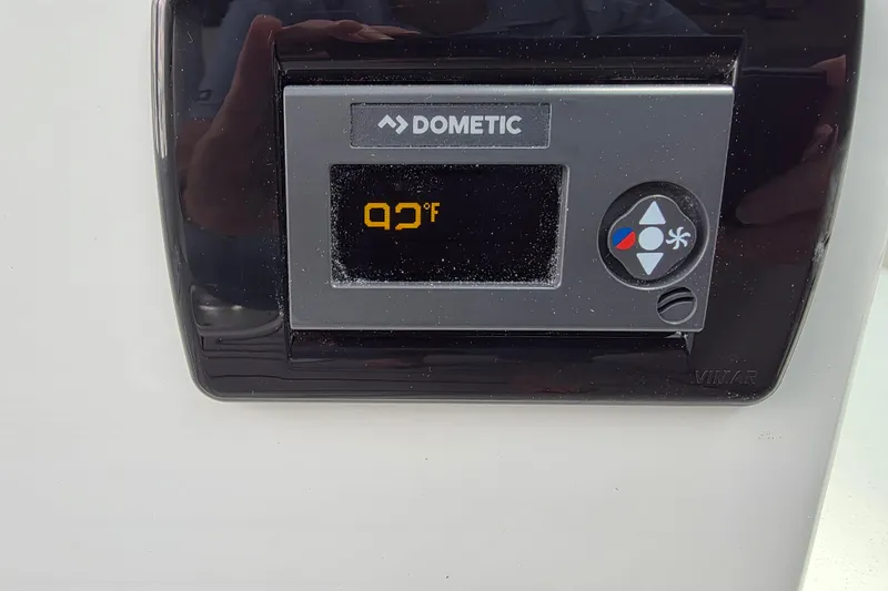 Slide: The Image of Dometic control panel displaying 92°F on a Parker 247 Explorer, 2026 model. - 21