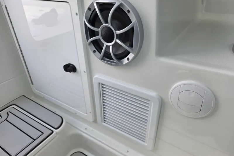 Slide: The Image of Interior of 2026 Parker 247 Explorer boat featuring speaker and control panel. - 22