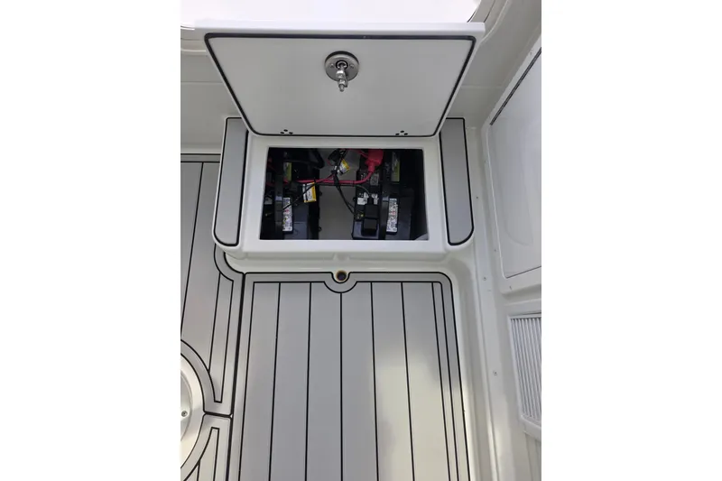 Slide: The Image of Battery compartment of 2026 Parker 247 Explorer boat with open hatch. - 23
