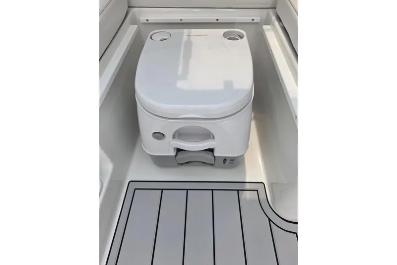 Slide: The Image of Portable toilet on Parker 247 Explorer boat, 2026 model, with sleek interior design. - 25