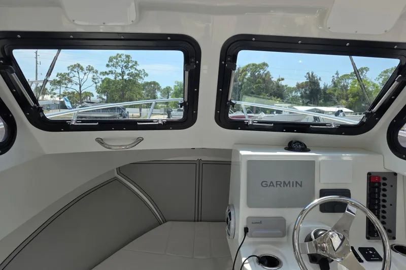 Slide: The Image of Interior view of 2026 Parker 247 Explorer boat with Garmin navigation system. - 26