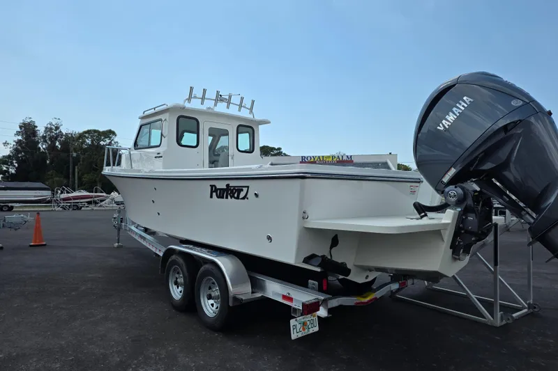 Slide: The Image of 2026 Parker 247 Explorer boat on trailer with Yamaha outboard motor. - 8