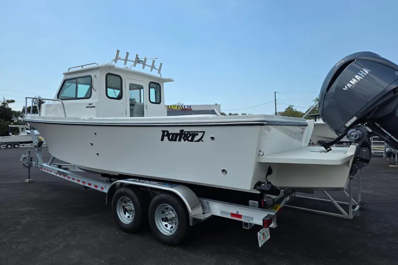 Slide: The Image of 2026 Parker 247 Explorer boat on trailer with Yamaha outboard motor. - 9