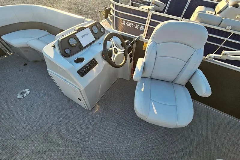 Slide: The Image of 2021 Bentley Pontoons 223 Fish-N-Cruise interior with helm and seating area. - 10